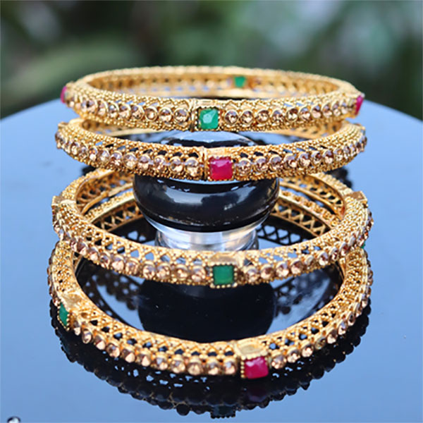Elevate Your Wristwear Collection with a Set of Four Elegant Golden Crystal Bangles A Timeless Addition for Women and Girls Alike